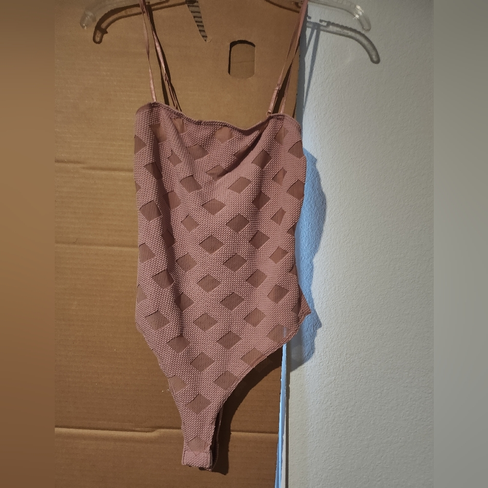 Pink body suit